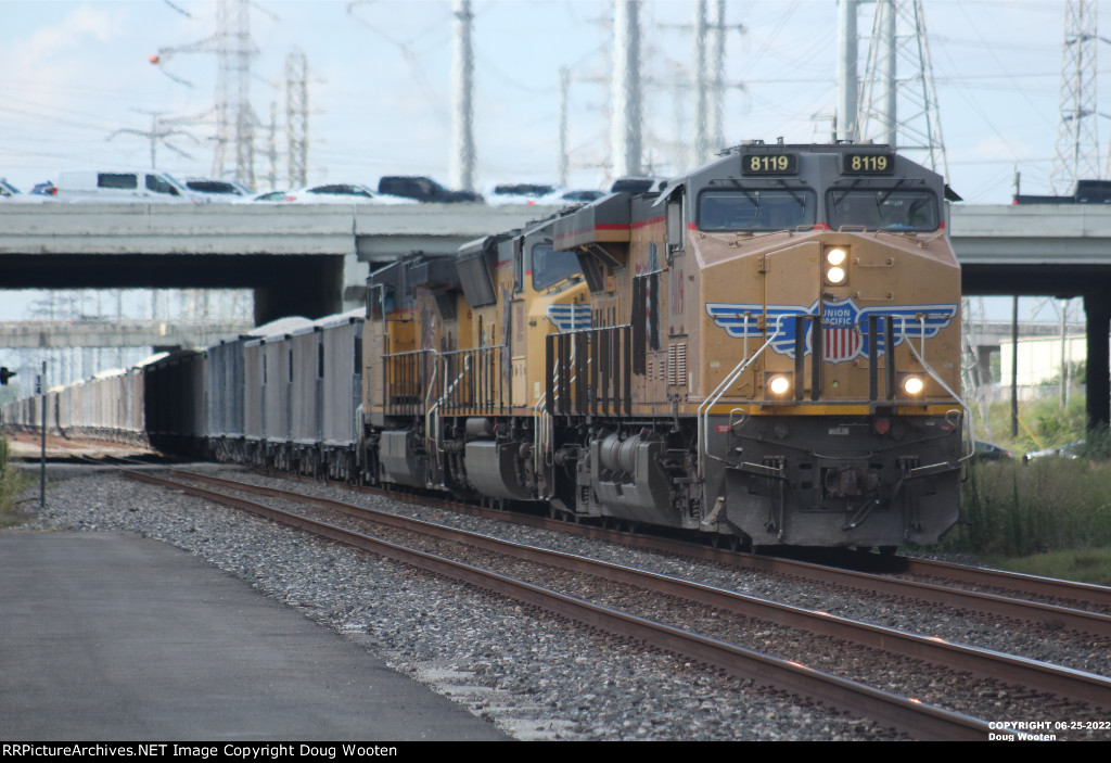 With a C45AH on the point, a loaded rock train heads east.